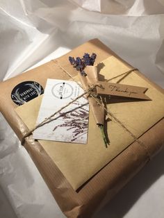 a package wrapped in brown paper and tied with twine