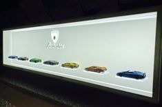 a display case with different types of cars on it