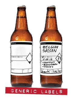 two beer bottles with labels on them sitting next to each other