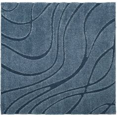 a blue rug with wavy lines on it