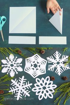 paper snowflakes and pine cones cut out on a table with scissors, evergreen needles and glue