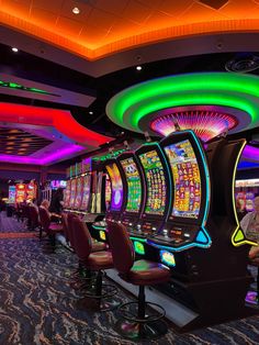 a casino room filled with lots of slot machines