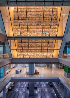 the inside of a large building with lots of books on it