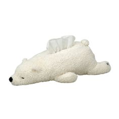 a white polar bear laying on its side with a tissue roll in it's mouth