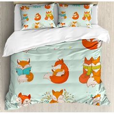 an image of a bed with foxes and books on it's cover, as well as the comforter