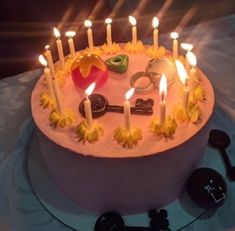 a birthday cake with lit candles on it