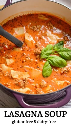 lasagna soup in a purple pot with basil on top and text overlay that reads lasagna soup gluten free & dairy - free