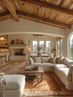 a living room filled with furniture and lots of windows on top of it's walls