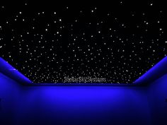 an empty room with blue lighting and stars in the sky on the ceiling above it