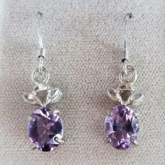 New!! Beautiful Sterling Silver 925 Amethyst Oval Shaped Dangle Earrings With Floral Accent The Perfect Gift! Stone: Natural Purple Amethyst Stone Size: 8.2 X 6.8 Mm Total Item Weight: 3 Grams Be Sure To Add Me To Your Favorites List! Check Out My Other Items! Check Out Our Other Items To Bundle And Save. Want To Make A Bundle, We Are Happy To Combine If You Ask Before Purchase. ~ Fast Shipping With Tracking. We Ship Daily! ~ Secure Payments ~ Long-Time Experienced Seller. ~ We Recycle Boxes Whe Grad Jewelry, Purple Dangle Earrings, Ivory Earrings, Long Drop Earrings, Cz Stud Earrings, Favorites List, Amethyst Purple, Crazy Lace Agate, Amethyst Earrings