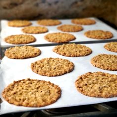 several cookies are cooling on the oven rack and ready to be baked in the oven