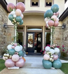 balloons and flowers decorate the entrance to a home