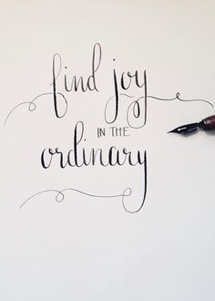 a pen and some writing on top of a piece of paper with the words find joy in the ordinary