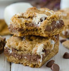 chocolate chip cookie bars stacked on top of each other with marshmallows around them