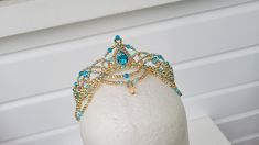 Handmade crystal ballet headpiece in your choice of pastel colour with silver or gold (pictured is aqua with gold). Suitable for Raymonda, Pas de Trois from Swan Lake, any of the Sleeping Beauty Fairies, Princess Florine, Medora, Gulnare, Pas d'Esclave, Odalisque, and more. Made with crystal beads, acrylic pearls, and a crystal teardrop jewel.   Shipping Information: - Shipping to the United States and Canada takes approx. 4 to 14 working days. - Shipping to the United States with Express Upgrade takes approx. 4 to 10 days. - Shipping to Australia takes approx. 4 to 14 working days. - Shipping to Asia takes approx. 4 to 12 working days. - Shipping to Europe, United Kingdom, and South America takes approx. 2 to 6 weeks. - Shipping within New Zealand takes approx. 1 to 5 working days. - Ship Ballet Crowns, Ballet Tiaras, Ballet Headpieces, Sleeping Beauty Fairies, The Sleeping Beauty, Ballet Beautiful, Costume Hats, Swan Lake, Blue Bird