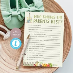 a baby's book and its parent's shoes on top of a wooden plate