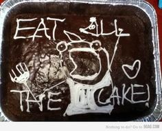 a chocolate cake with white frosting and writing on the side that says eat kill the cake