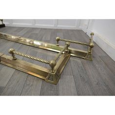 two antique brass door handles on the floor