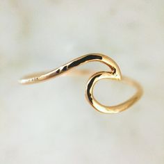 An ocean wave symbolizing power and strength. It makes for a beautiful stand-alone ring, as well as adds a lot of character to any ring stack. Finish: Hammered Metal: 14K Yellow, White or Rose Gold & Sterling Silver Gold Bar Earrings, Sapphire Wedding Band, Unique Bands, Flower Engagement Ring, Bar Stud Earrings, Wave Ring, Ocean Wave, Band Engagement Ring, Bar Earrings