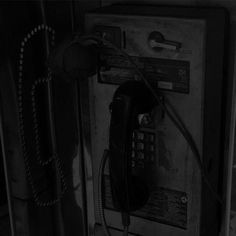 an old fashioned telephone is shown in black and white