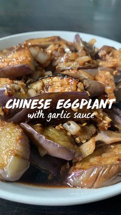 chinese eggplant with garlic sauce on a white plate