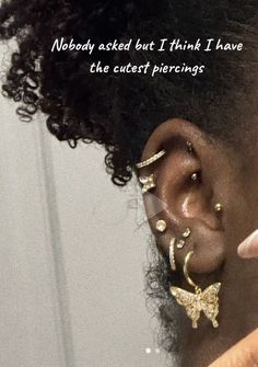 a close up of a person with ear piercings and a quote on the side