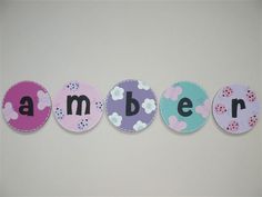 the word ambien is made up of circles with flowers and polka dots on them