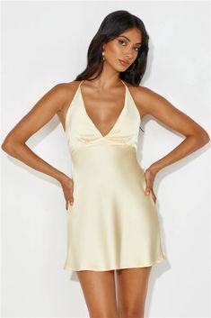 Length from bust to hem of size S: 73cm.   Chest 35cm, Waist 32cm, across front only of size S.   Mini dress.  Lined.  Model is a standard XS and is wearing size XS.  True to size.  Non-stretch.  Elastic back.  Halter tie.  Tie-up back.  Slip on.  Cold hand wash only.  Polyester.   Level up your 'fit with the Yours To Love Satin Halter Mini Dress. Featuring an elastic back and a tie-up design! We're in love with this dress paired with heels and a sleek bun. Winter Formal Dresses Mini, Yellow Satin Mini Dress, Hoco Dresses Satin, Halter Homecoming Dress, Coral Mini Dress, To Love, Sleek Bun, Halter Mini Dress, Dress Yellow