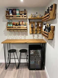 a small bar with two stools next to it