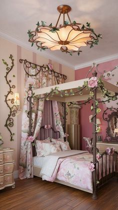 a canopy bed with pink flowers on it in a girls's bedroom decorated in pink and white