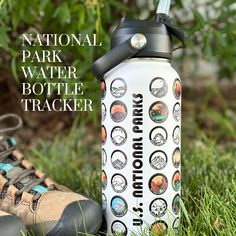 a water bottle sitting on the ground next to a pair of hiking shoes with text that reads national park water bottle tracker