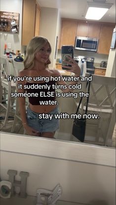 a woman taking a selfie in front of a mirror with the caption, if you're using hot water and it suddenly turns cold someone else is using the water? stay with me now