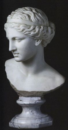 a white marble bust of a woman