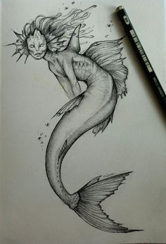 a pencil drawing of a mermaid sitting on top of a piece of paper