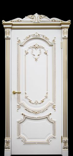 an ornate white door with gold trim