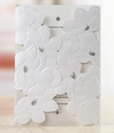 a card with white flowers on it