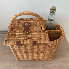 a wicker basket with two bottles in it