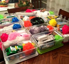 several plastic containers filled with different types of items