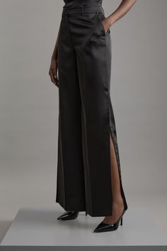 Delivering A Combination Of Dressed-Down Glamour And Statement Style, Discover Collections: 06 Partywear. A New Addition To A Tailored Essentials Collection, These Trousers Are Tailor-Made With An Easy To Style, Sleek Design, Split Detailing, And A Comfortable Wide Fit. The Satin Fabric Makes For A Unique Take On A Formal Outer Layer. Style This Piece With A Shirt And Heels For A Look That Goes Seamlessly From Occasion Nights To Date Nights. Structured Viscose Satin Tailored Wide Leg Trousers Hi Evening Satin Straight Leg Bottoms, Satin Straight Pants For Evening, Satin Pants For Evening, Evening Satin Straight Pants, Evening Straight Satin Pants, Silk Straight Pants For Evening, Formal Satin Straight Pants, Sleek Satin Pants For Formal Occasions, Sleek Satin Pants For Evening