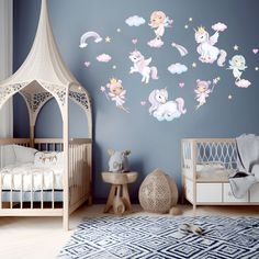 a baby's room with blue walls and white furniture