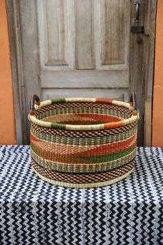 a woven basket sitting on top of a table