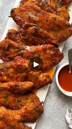 chicken wings with dipping sauce on the side