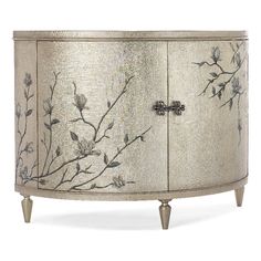 an antique style cabinet with flowers painted on the doors and drawers, along with metal legs