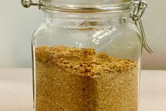 a glass jar filled with food sitting on top of a table