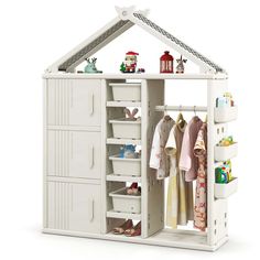 a white dollhouse with clothes and toys in it's storage area, on a white background