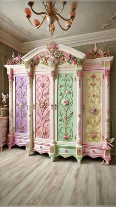 an ornately painted armoire in pink, green and yellow