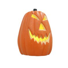 an orange halloween pumpkin with glowing eyes on it's face and mouth, against a white background