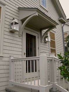 the front porch of a house with white trim