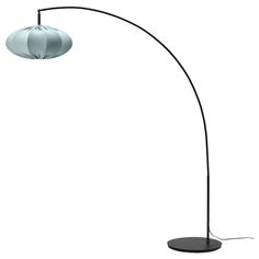 a black and white floor lamp with two lamps on top of the base, one light is