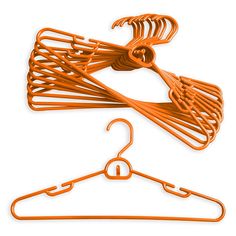 two orange clothes hangers on a white background